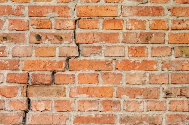 Brick wall cracking showing signs of a foundation problem.