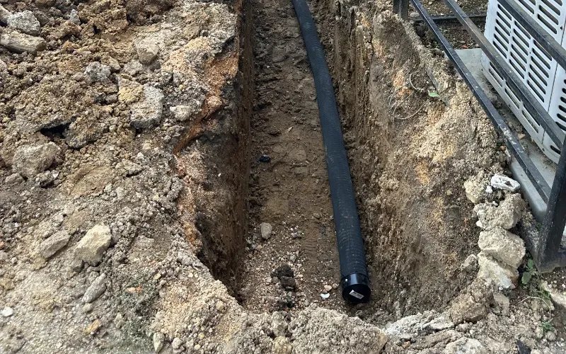 Foundation repair digging water drainage.