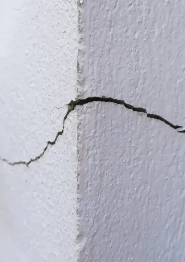 Foundation stress cracks caused by soil erosion.