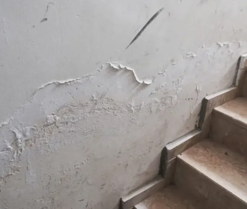 Water damage on basement walls.